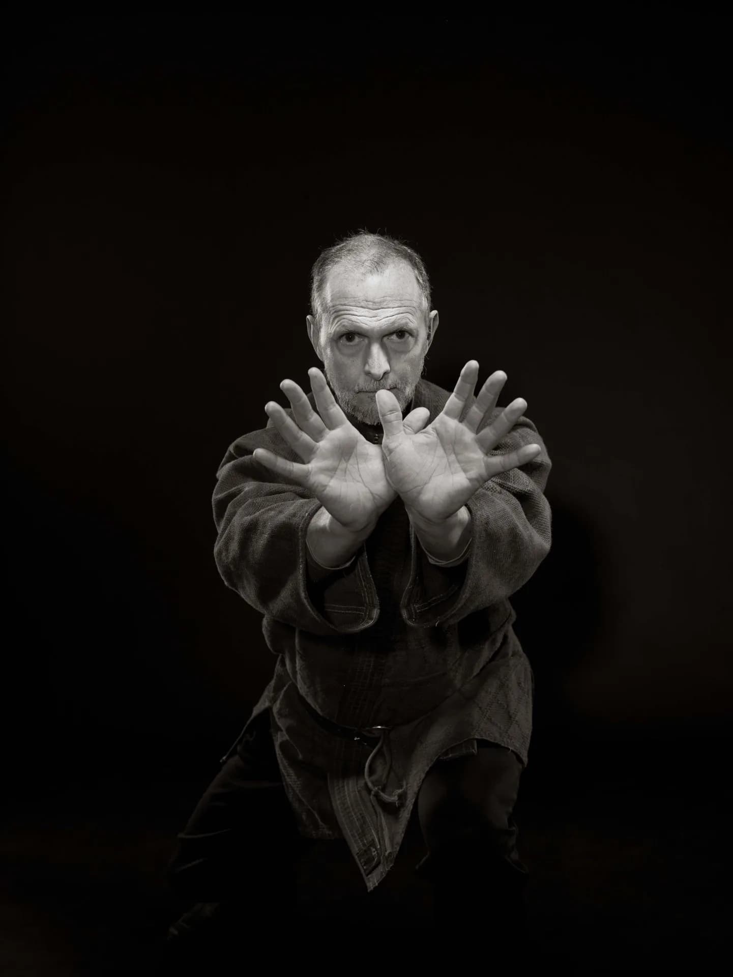 Allen Pittman in a poised gesture of attention