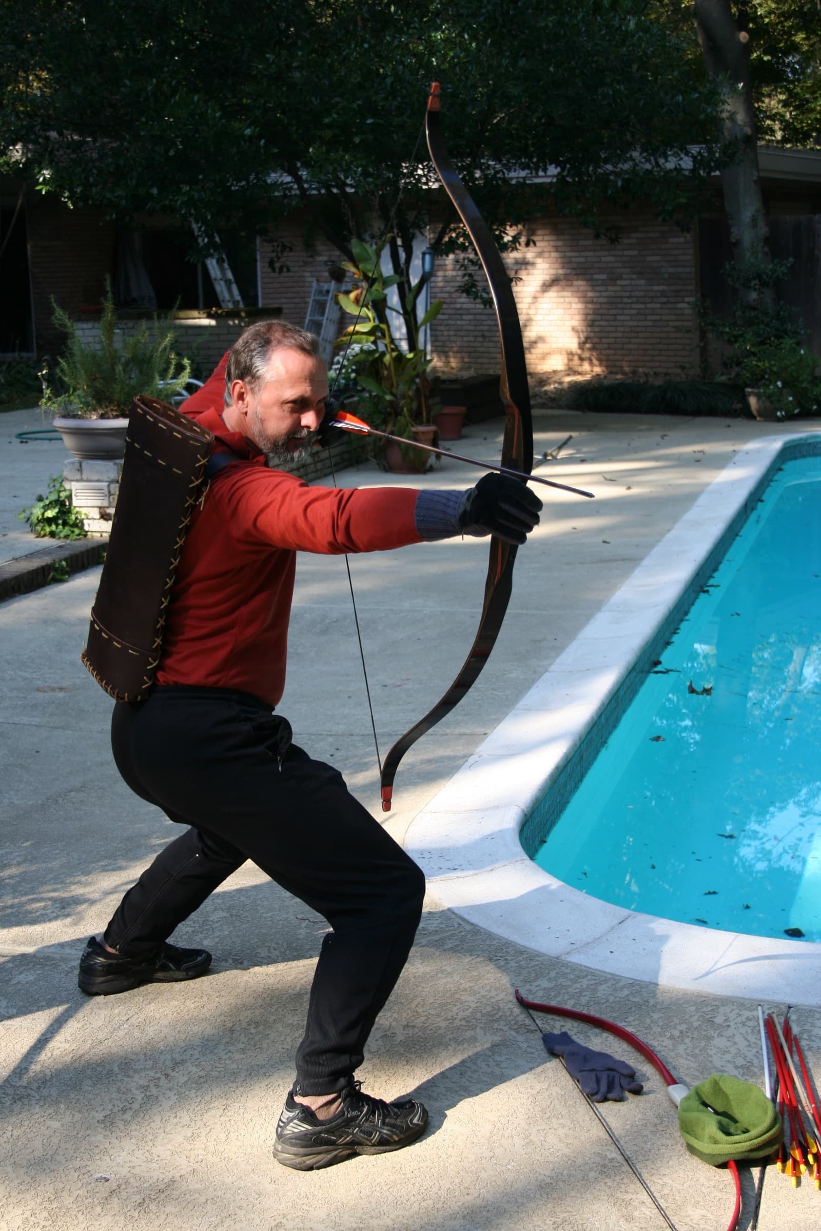 Allen Pittman drawing a longbow from a low horse stance