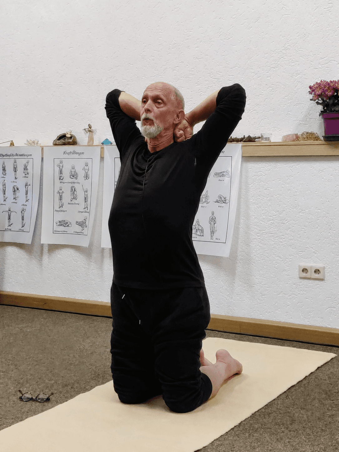 Allen Pittman practising a kneeling neck and shoulder movement
